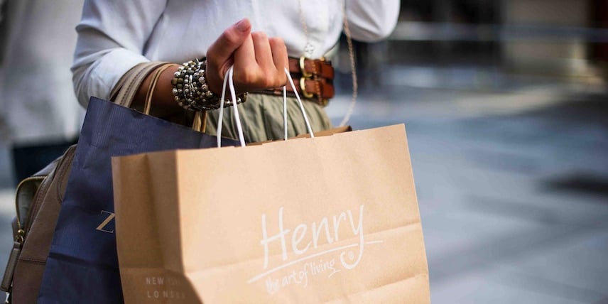 Person carrying shopping bags